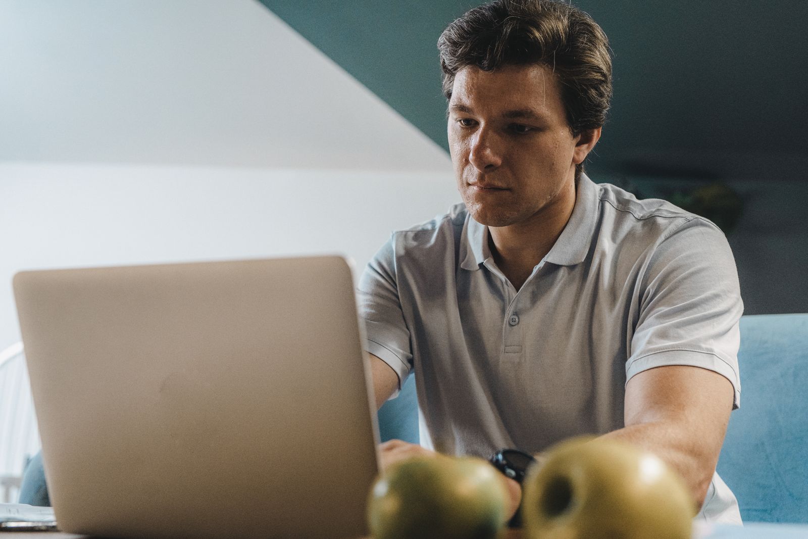 Freelancer working independently on a laptop at a home table